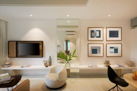 black flat screen tv on white wooden tv rack